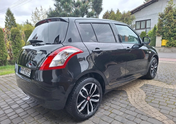 Suzuki Swift cena 34700 przebieg: 100200, rok produkcji 2015 z Żychlin małe 326